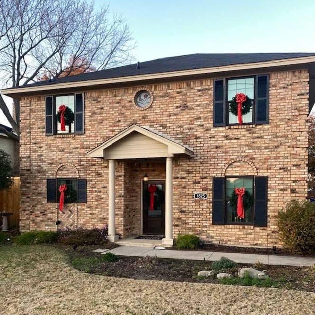 New shingle roof on a two-story brick home